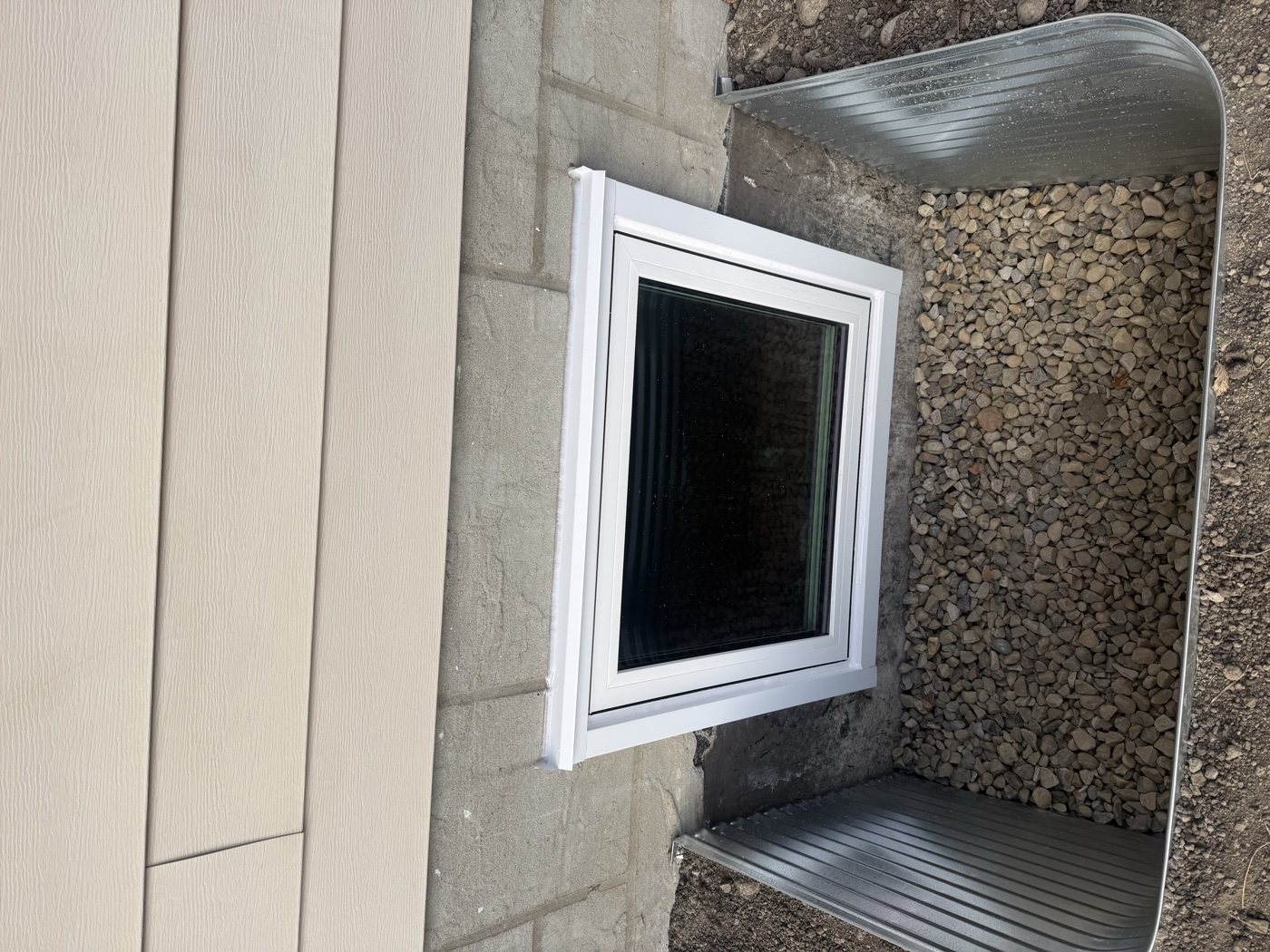 Egress casement window exterior view — Calgary home installation
